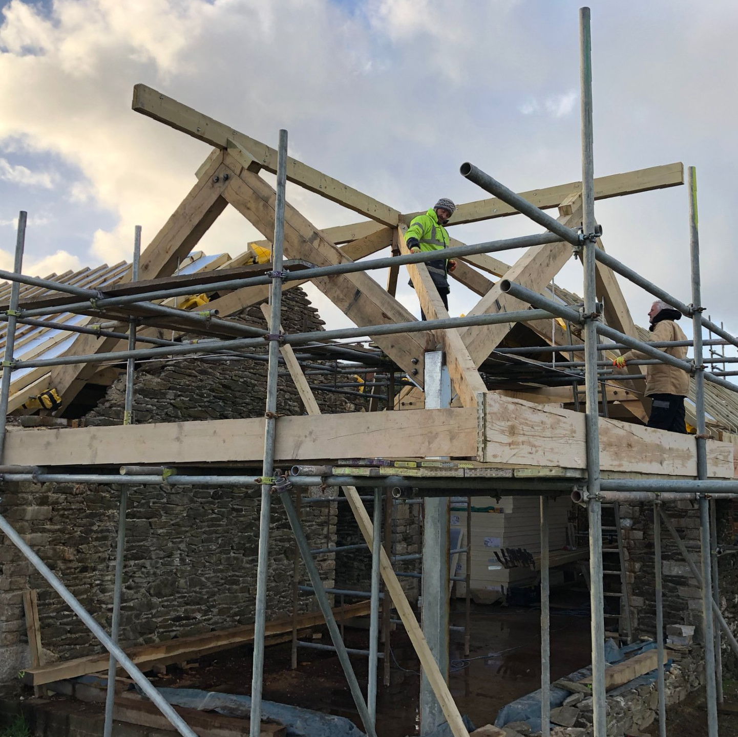Photo of barn roof structure going in