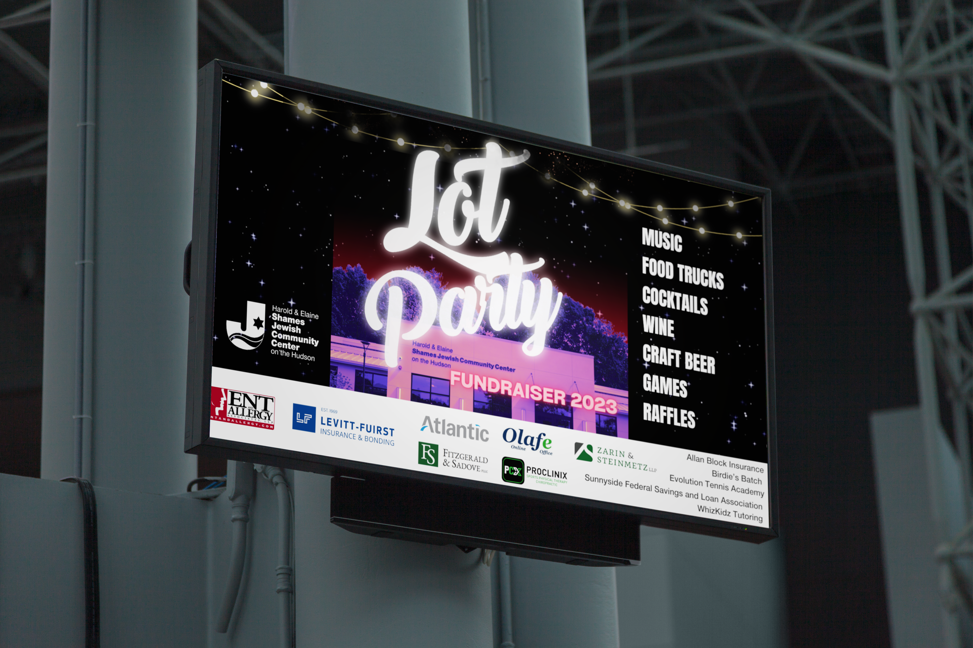 A large screen hanging from a pole that says lot party