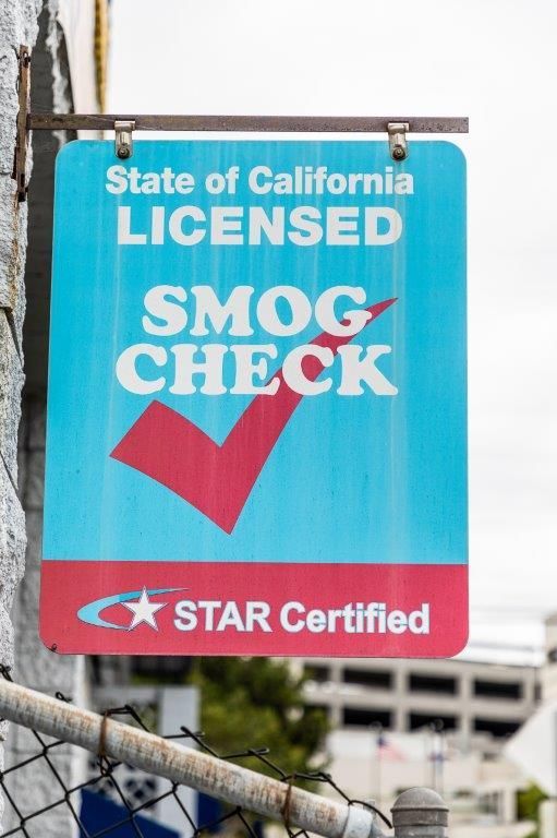 Sign: State of California Licensed Smog Check, with red check mark and STAR Certified logo.