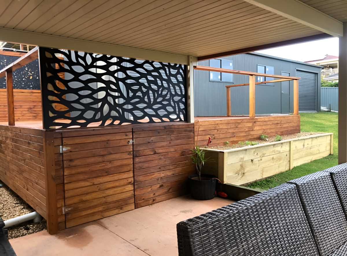 A Patio With A Wooden Deck And A Metal Screen — J.White Carpentry & Renovations in Port Macquarie, NSW
