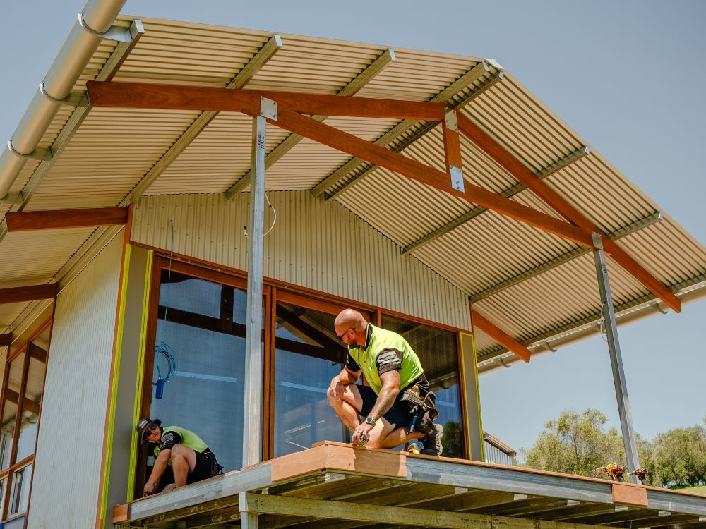 Two Men Are Working On A House Under Construction — J.White Carpentry & Renovations in Port Macquarie, NSW 