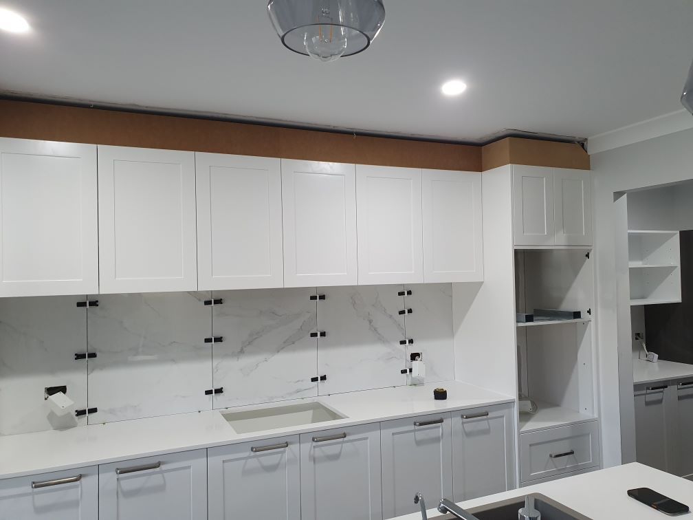 A Home Kitchen With White Cabinets Renovations — J.White Carpentry & Renovations in Port Macquarie, NSW
