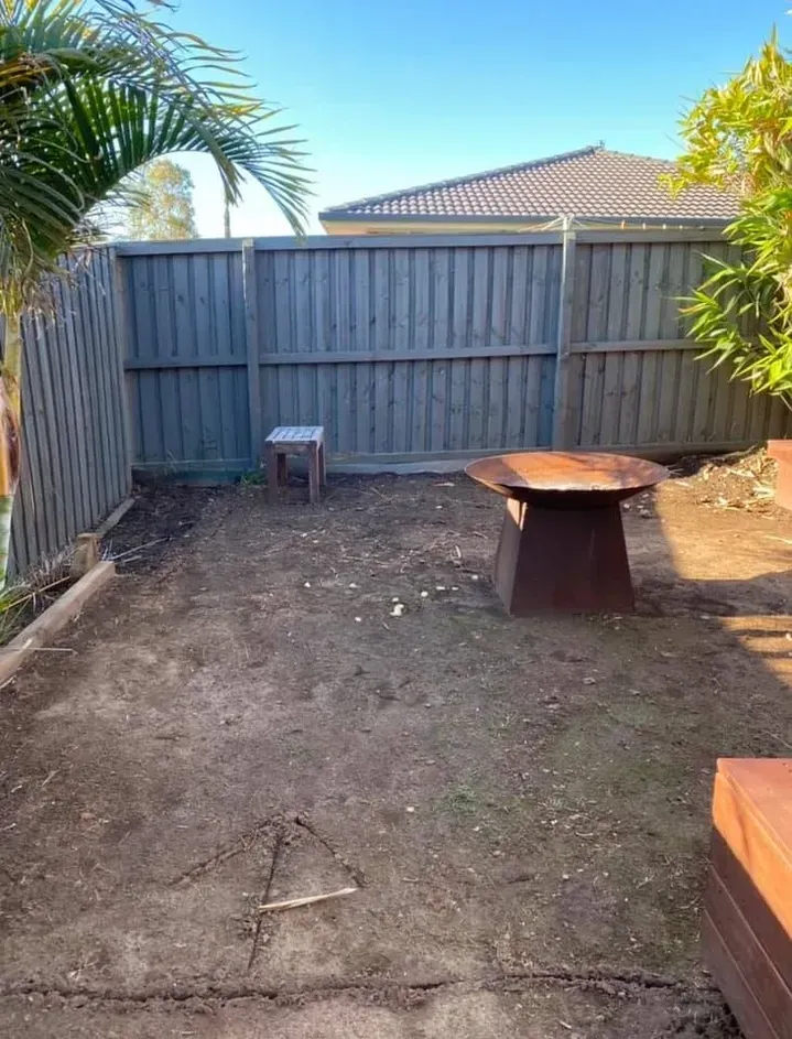 There is a fire pit in the middle of the backyard. — J.White Carpentry & Renovations in Port Macquarie, NSW 