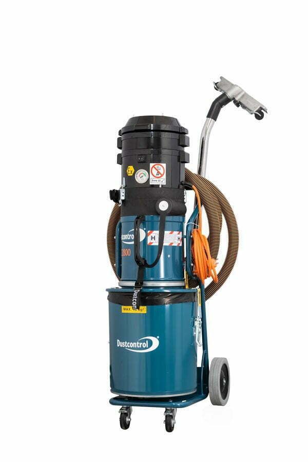 Blue industrial wet/dry vacuum cleaner with attached hose and attachments on a wheeled cart