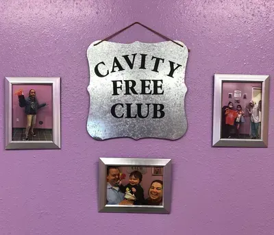 Purple wall with pictures