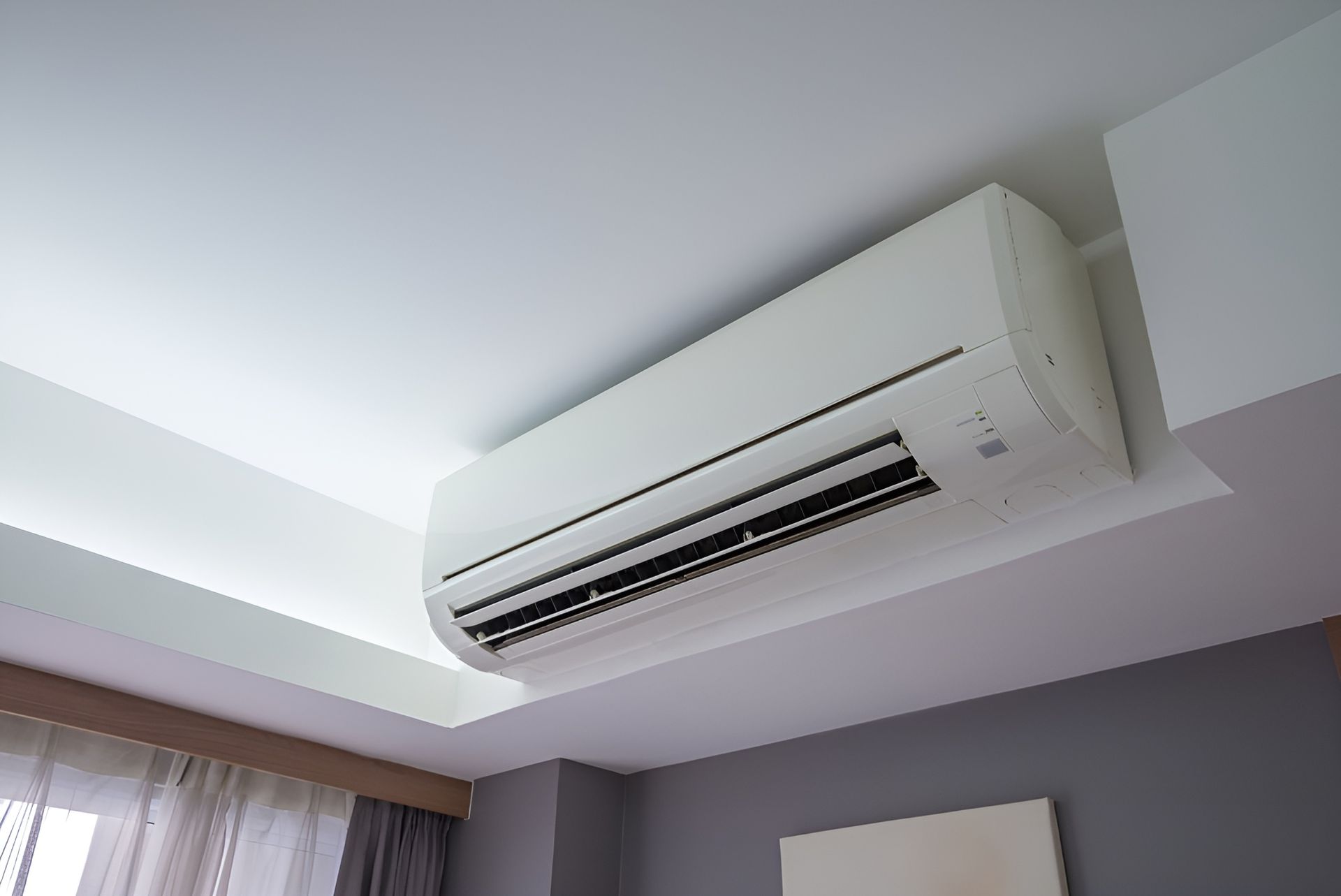 White Wall-Mounted Air Conditioner with Green Accent — Messina Air Conditioning & Electrical in Portsmith, QLD