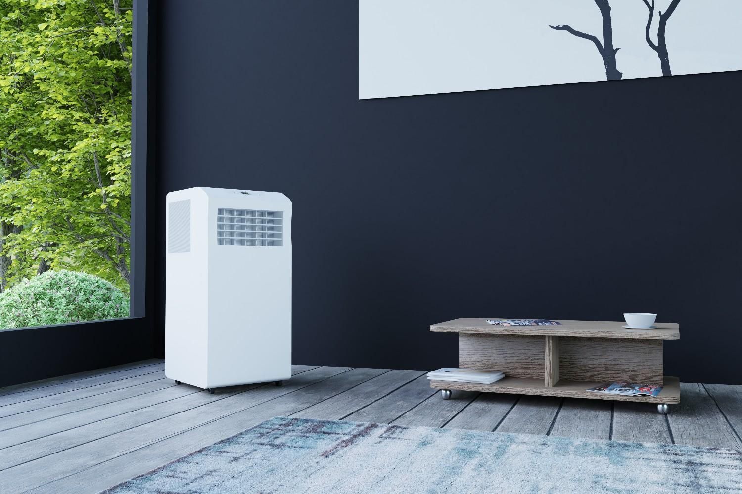 White Portable Air Conditioner in A Room with A Dark Wall — Messina Air Conditioning & Electrical in Palm Cove, QLD