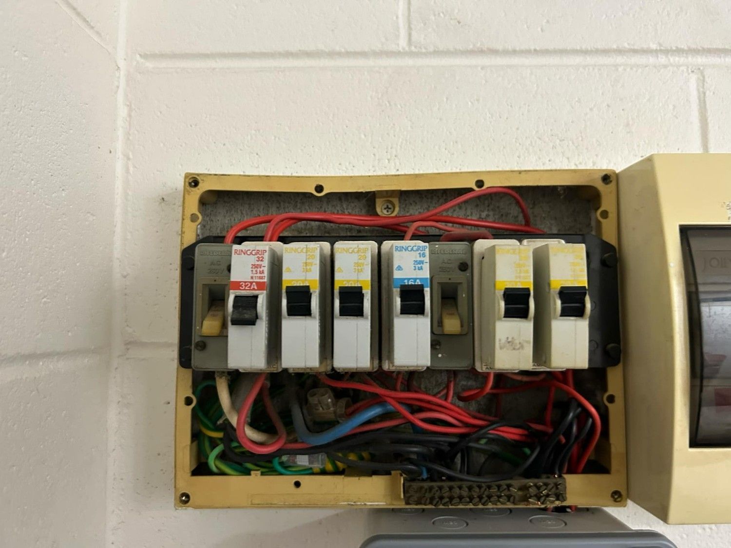 An Open Electrical Panel with Six Circuit Breakers — Messina Air Conditioning & Electrical in Smithfield, QLD