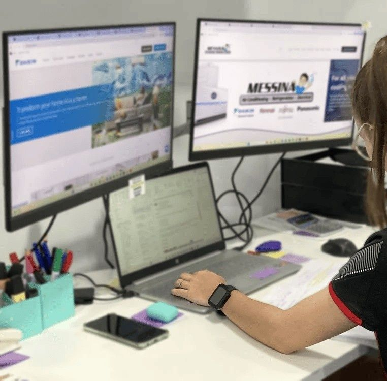 Person with Red-And-Black Gloves Installs a Lightbulb — Messina Air Conditioning & Electrical in Portsmith, QLD