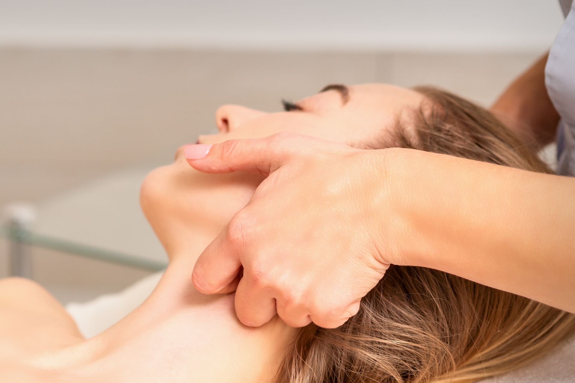 Person receiving a neck massage in a spa setting