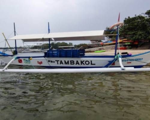 A white and blue outrigger boat named 