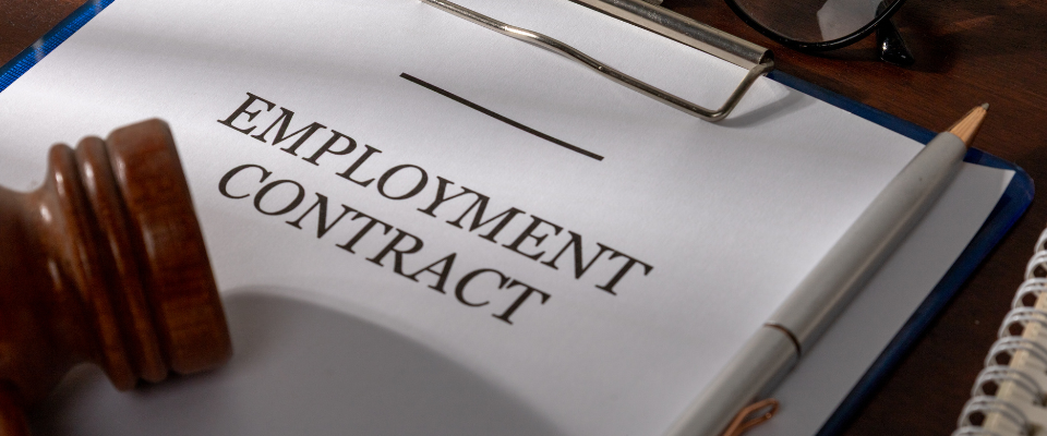 Employment contract for UK business with legal gavel symbolising employment law, HR compliance