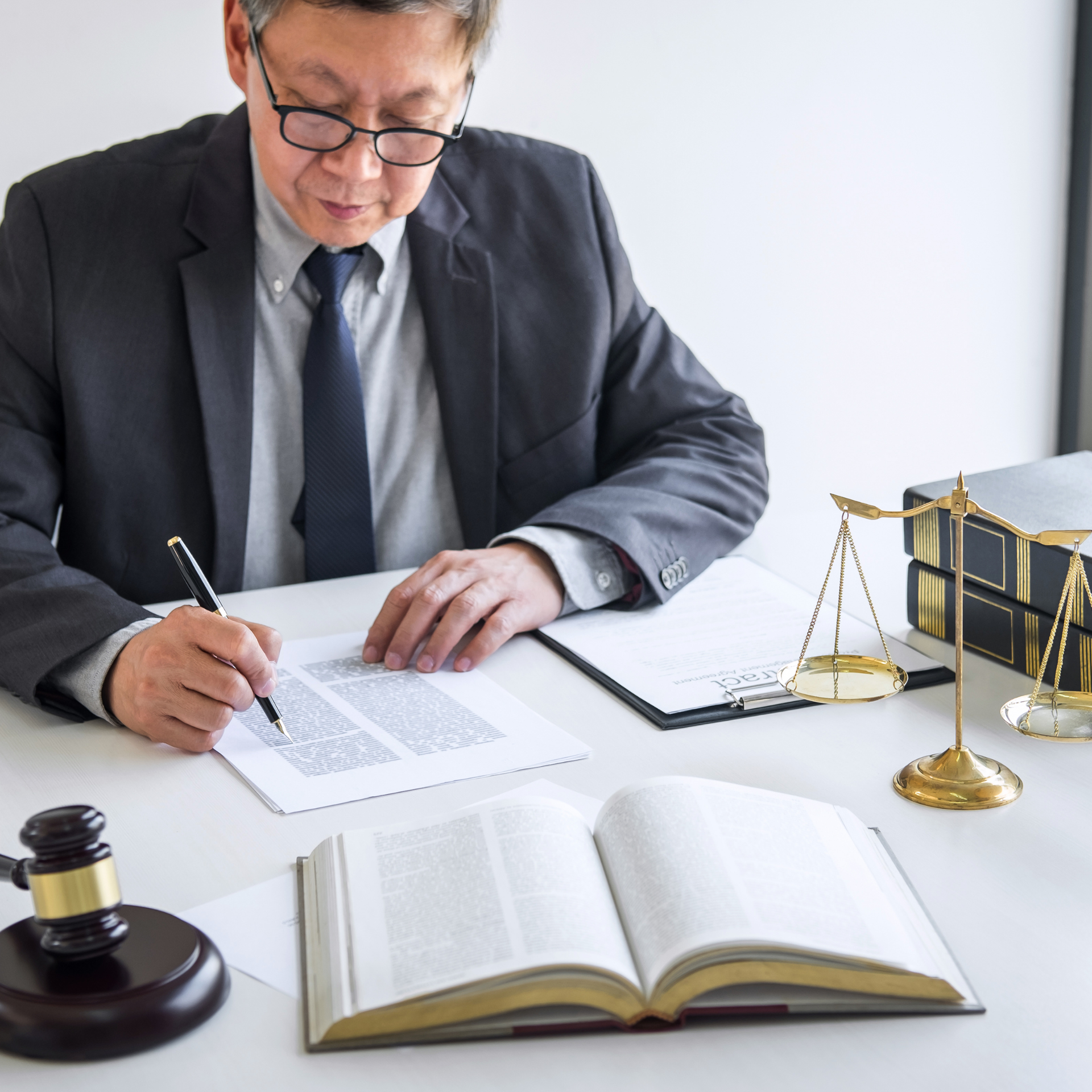 Judge’s gavel and sound block on a wooden desk