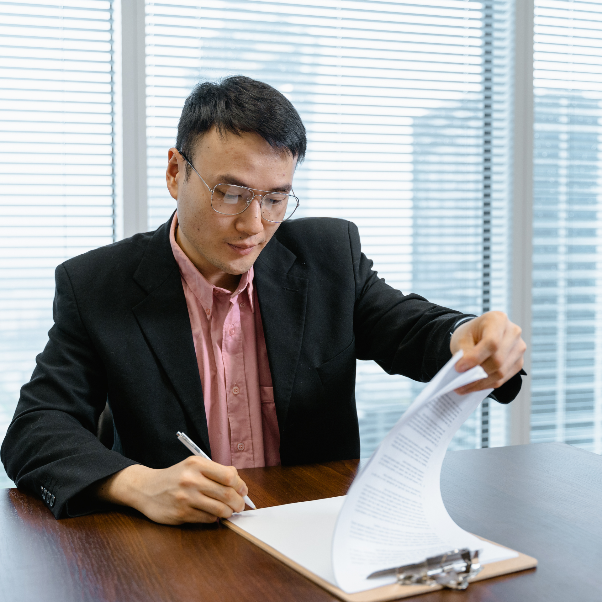 Smiling professional shaking hands in an office