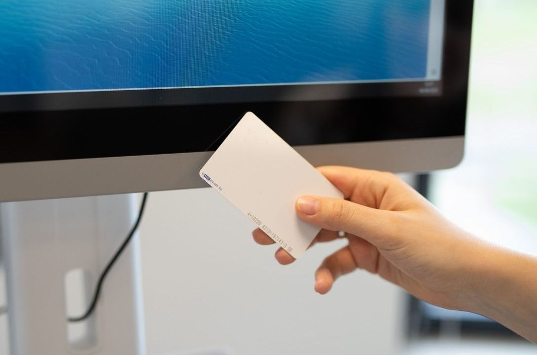 Tapping an RFID badge against the POC-4 medical panel PC to log in