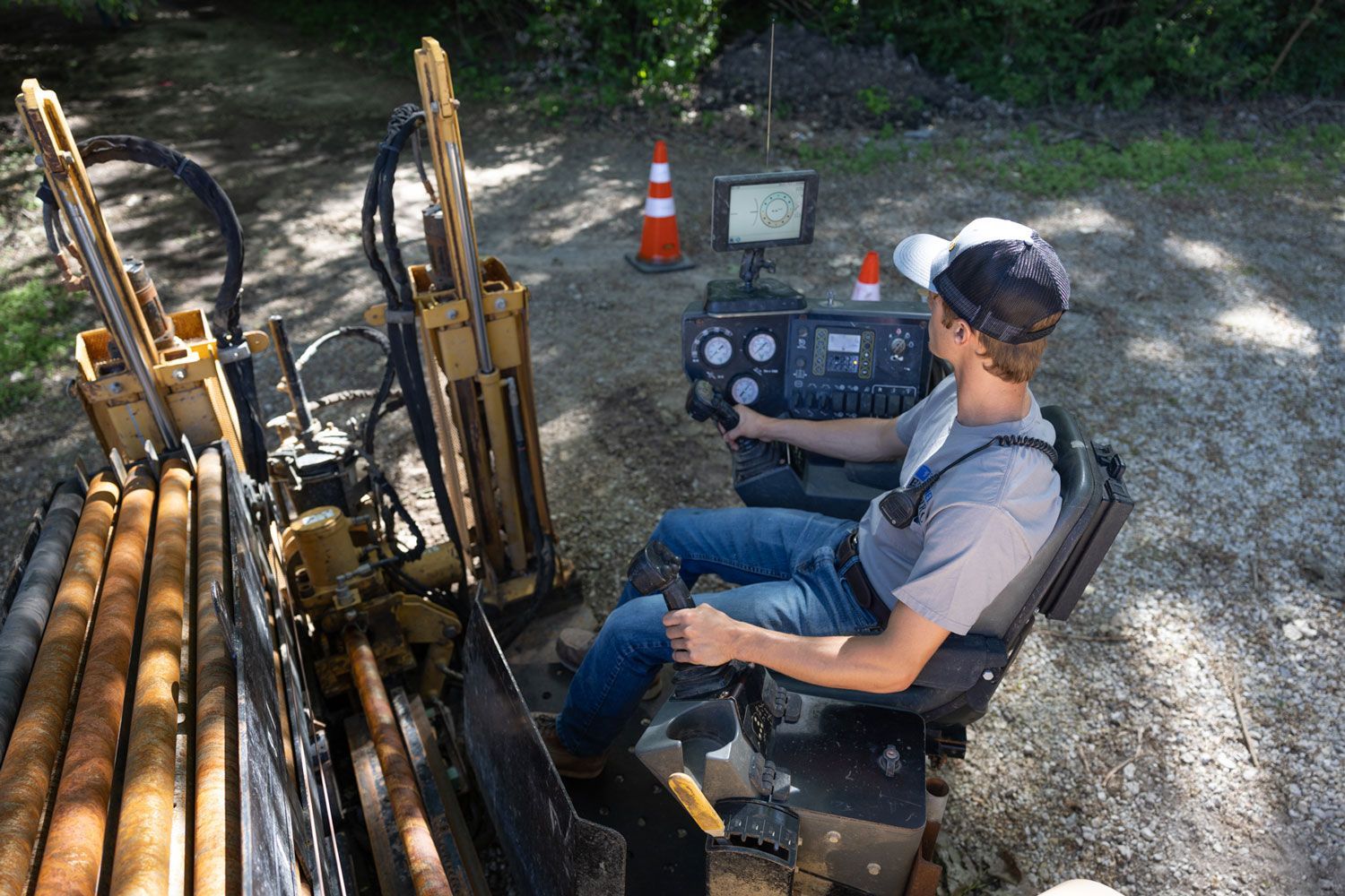 A man is sitting in the driver 's seat of a machine.