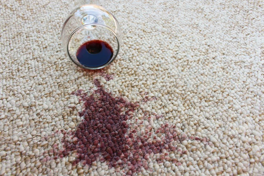 A Glass Of Red Wine Spilled On A Carpet — Mr Steam Clean Tweed Coast In Kingscliff, NSW