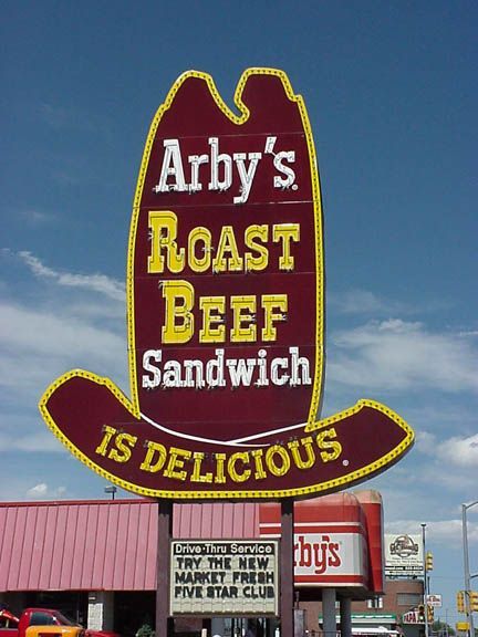 Arby’s Roast Beef Sandwich roadside sign against a blue sky