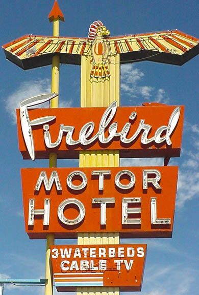Vintage Firebird Motor Hotel sign with red and orange lettering against a blue sky