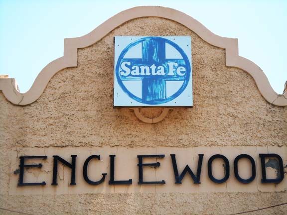 Santa Fe sign above the word “ENCLWOOD” on a stucco building facade