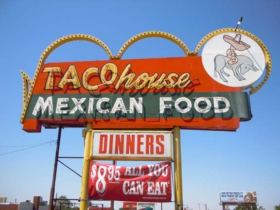 Vintage “Taco House Mexican Food” roadside sign with “Dinners” and “85¢ all you can eat” panels