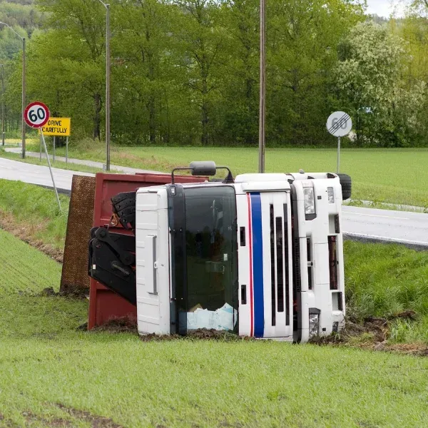An image showing a dump truck rollover accident.