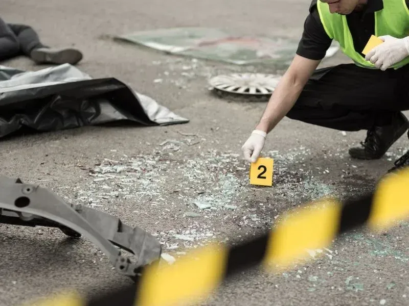 An image showing a legal team conducting a thorough investigation of a dump truck accident scene.