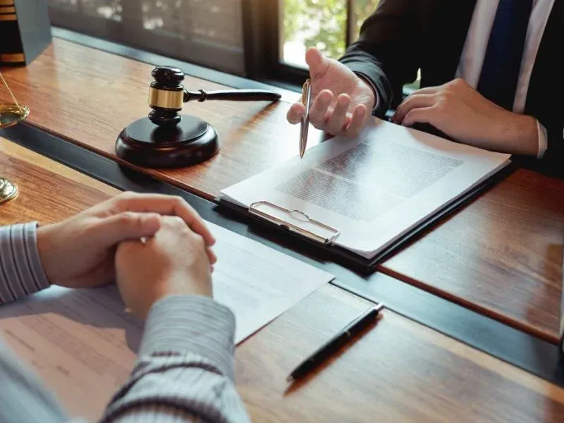 An image showing a truck accident lawyer consulting with a client in Georgia.