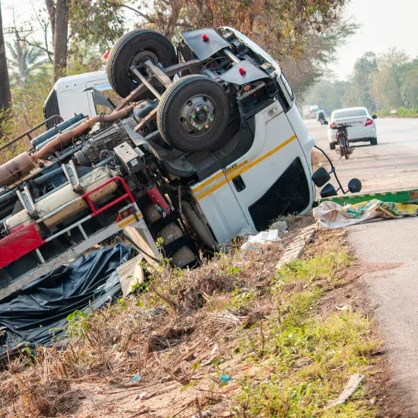 An image showing a rolled-over tractor-trailer on a Georgia road.