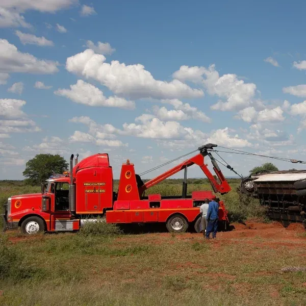 An image showing an accident caused by an improperly secured vehicle on a tow truck.