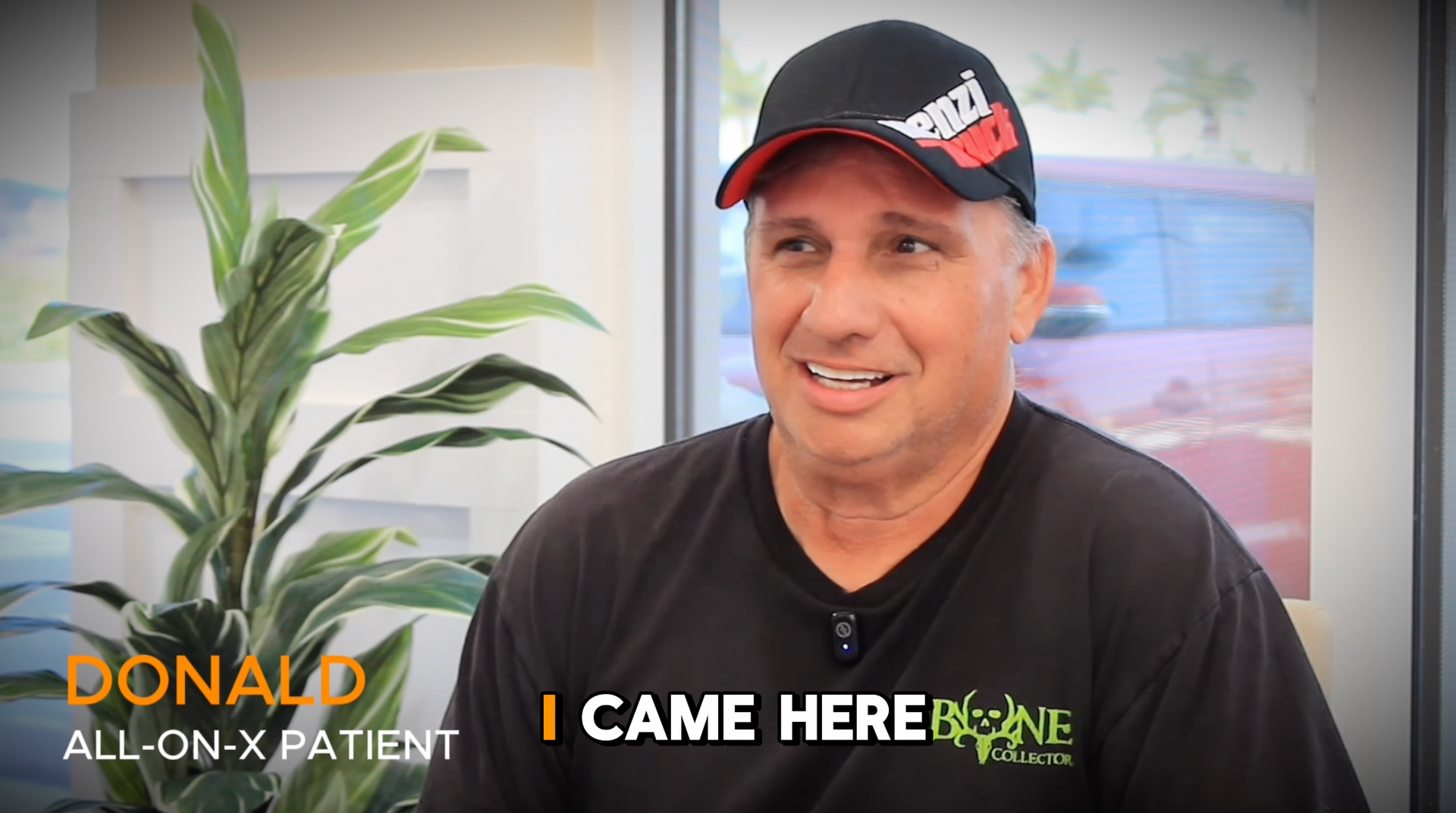 Image of happy dental  implant patient with a hat on  smiling
