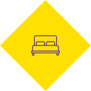 Purple bed icon inside a yellow diamond sign on a white background