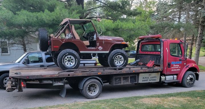 Brown Car On Truck - Rockford, MI - Nelson's Towing Brown Car On Truck - Rockford, MI - Nelson's Towing