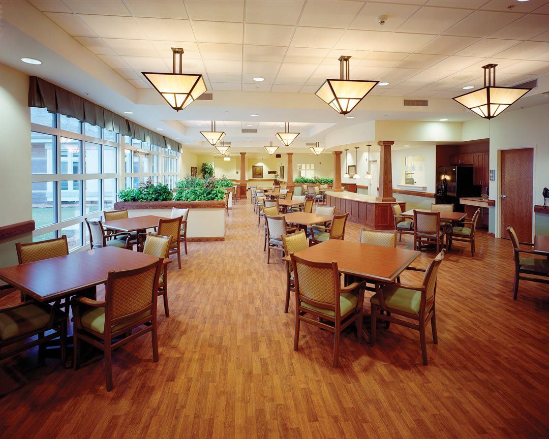 A large dining room with tables and chairs in it