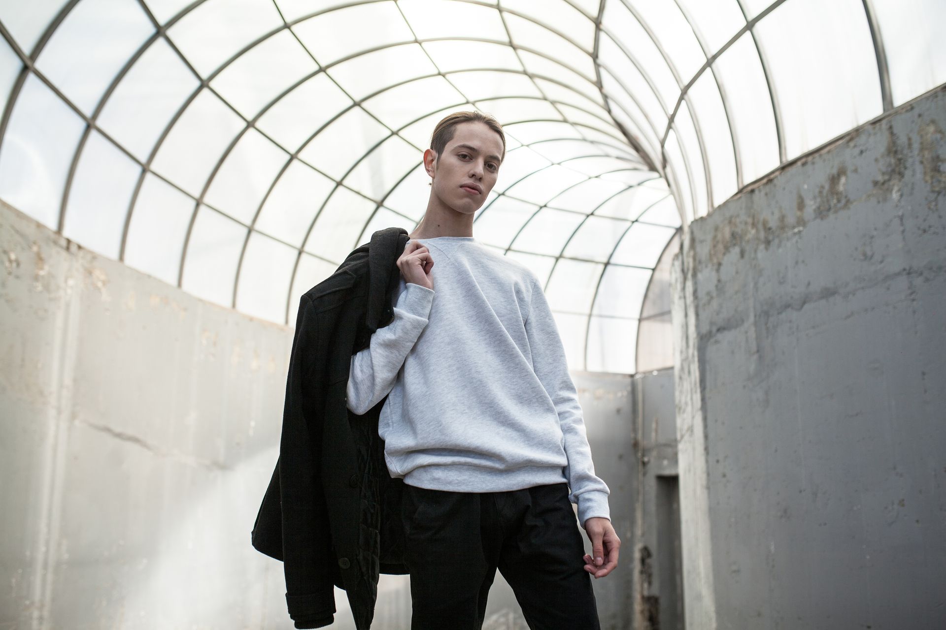 Wearing a gray sweatshirt