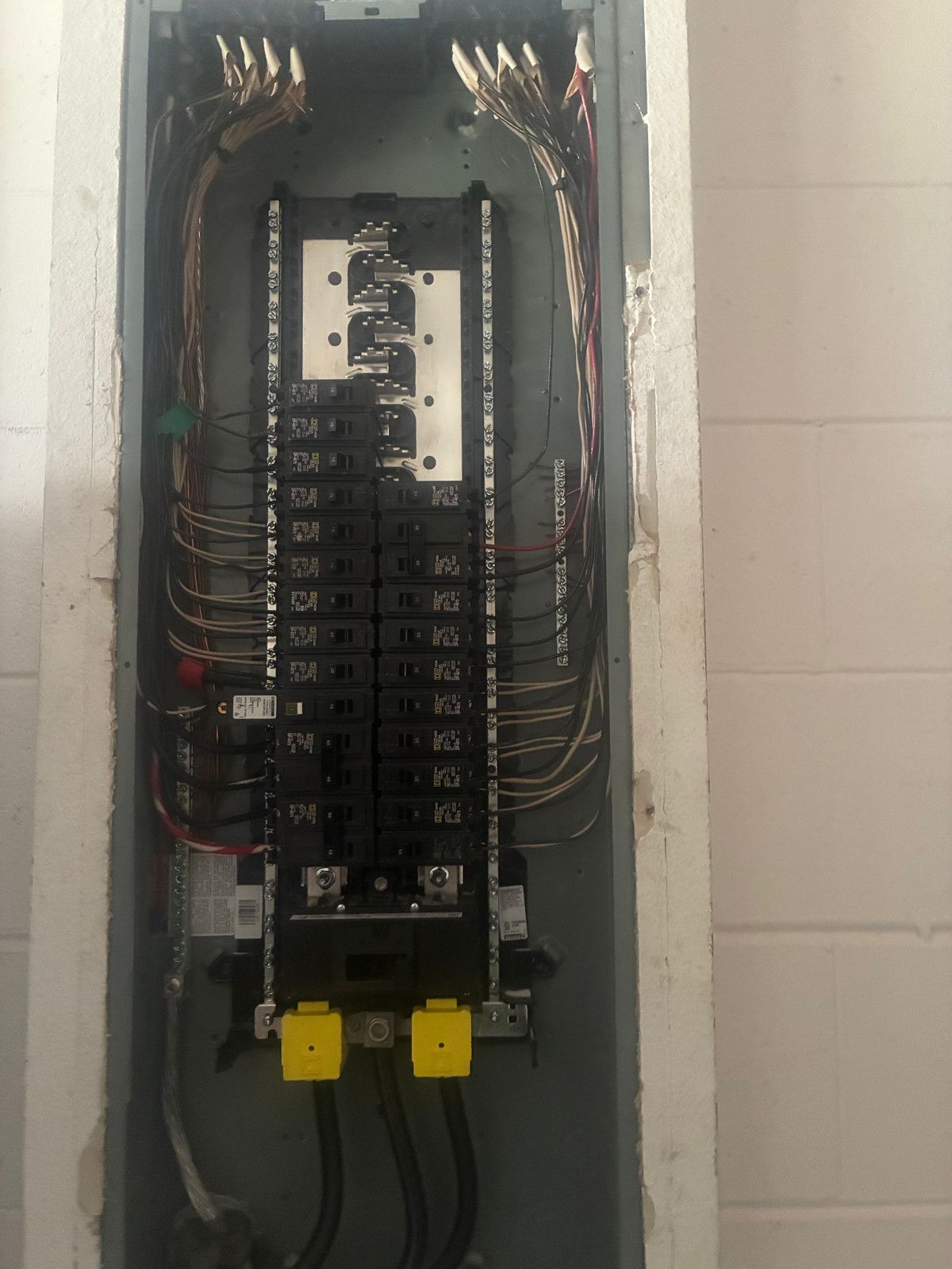 Open indoor 200-amp electrical panel during an upgrade in Four Corners, Florida
