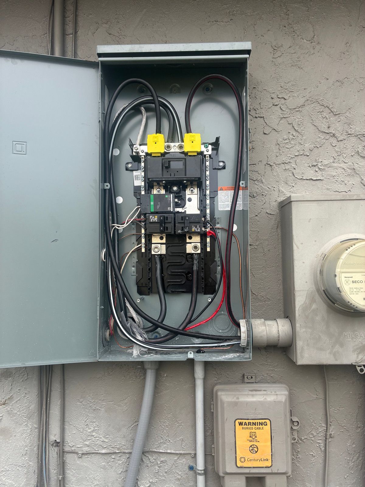 Open 200-amp outdoor main-breaker panel during replacement in Four Corners, Florida