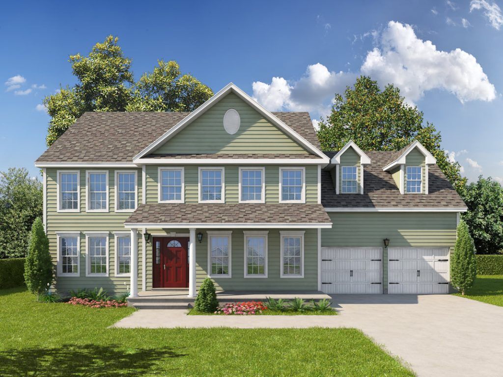A large green house with a red door is sitting on top of a lush green lawn.