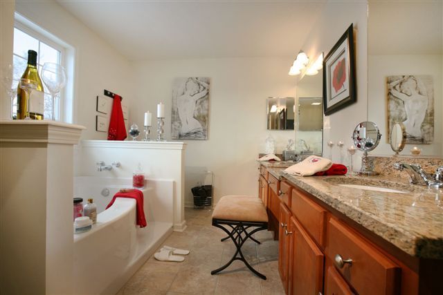 A bathroom with two sinks and a bathtub