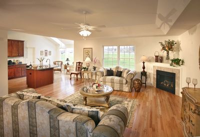 A living room filled with furniture and a fireplace.