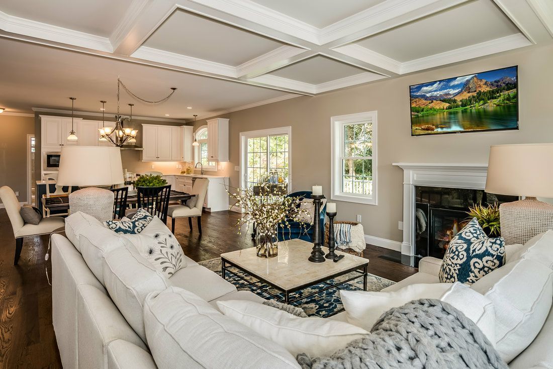 A living room filled with furniture and a fireplace.