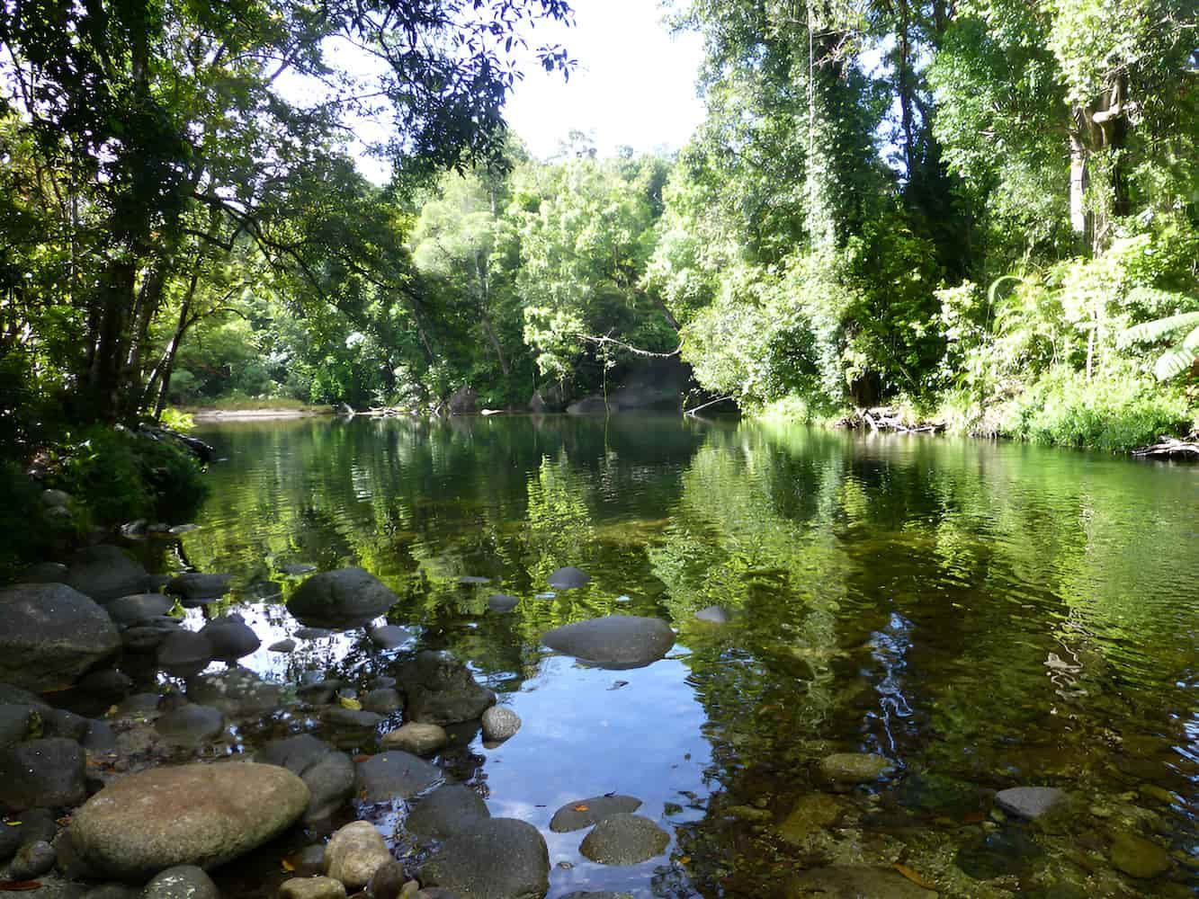 A River Surrounded by Trees and Rocks on a Sunny Day — John Day Plumbing in Howard Springs, NT