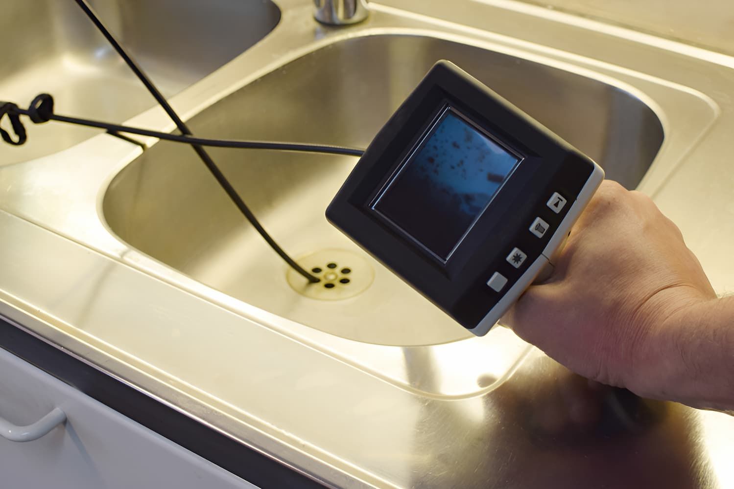 A Person is Holding a Camera in Front of a Sink — John Day Plumbing in Marlow Lagoon, NT