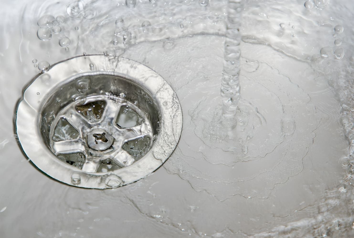 Water is Running Down a Drain in a Sink — John Day Plumbing in Marlow Lagoon, NT