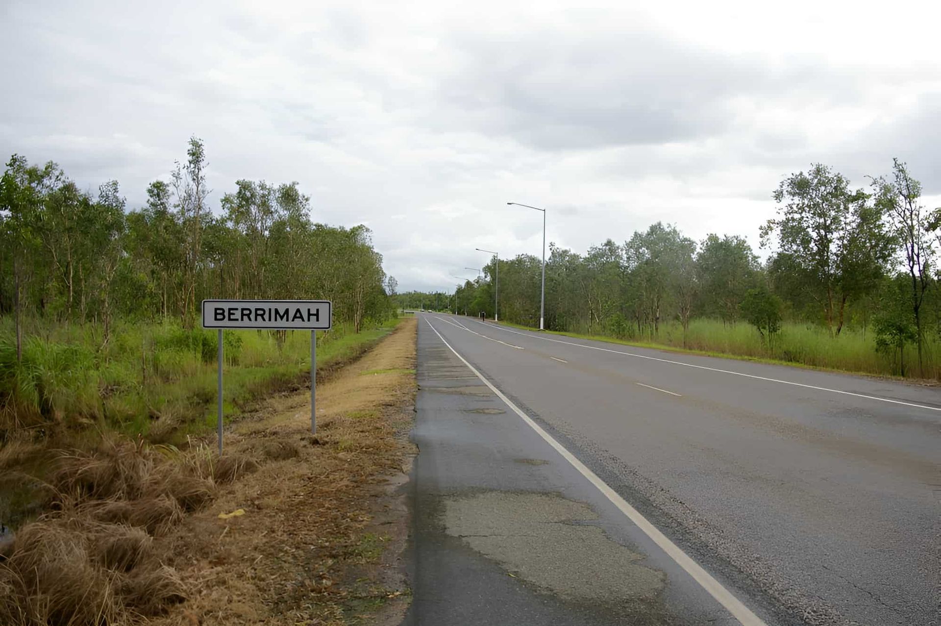 A Sign on the Side of a Road That Berrimah — John Day Plumbing in Berrimah, NT
