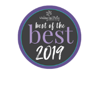 A dark gray circular award badge with a purple border, reading