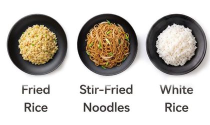 Three black plates with fried rice, stir-fried noodles, and white rice, each labeled underneath