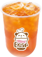 Orange iced drink in a clear cup with a cute “Bear” logo.