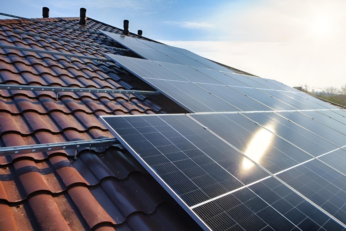 A Row of Solar Panels on a Tiled Roof — Power & Data Support Services In Manunda, QLD