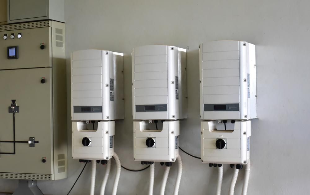 Three White Boxes Are Hanging on a Wall Next to Each Other — Power & Data Support Services In Karumba, QLD